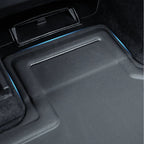 Black carbon fiber textured car floor mat with blue accent lighting