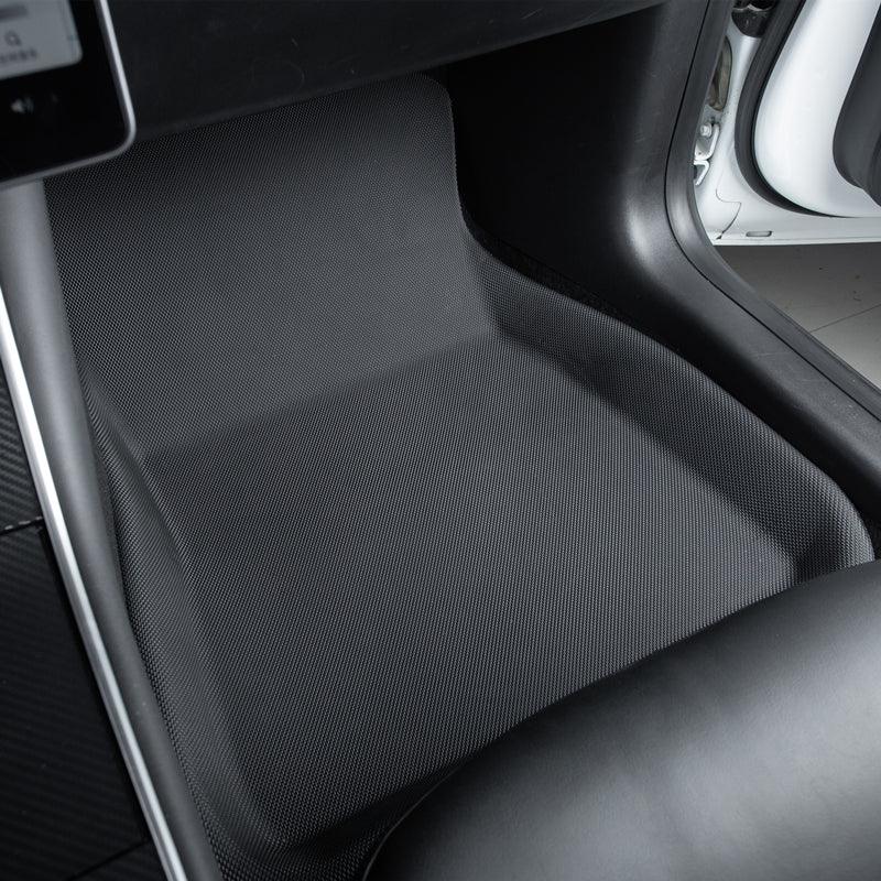 Custom-fit black honeycomb textured car floor mat for interior protection