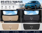 Photo collage showing the BYD Atto 3 trunk door protective mat in black and beige color options installed on the tailgate, alongside the BYD Atto 3 vehicle.