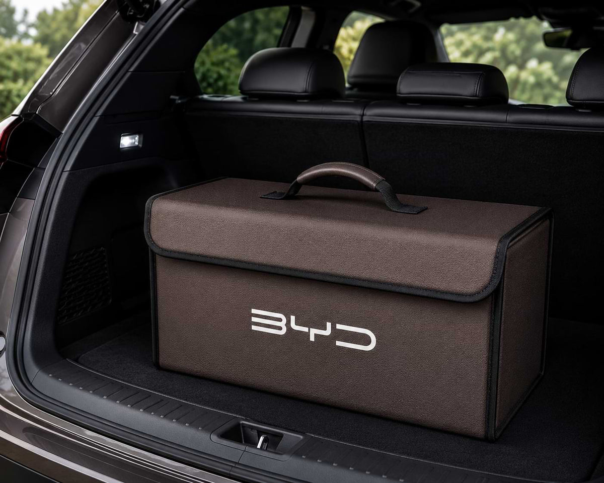 A premium BYD trunk storage organizer featuring a carbon fiber textured exterior, reinforced construction, and foldable design. Ideal for storing charging cables, emergency kits, tools, groceries, car care supplies, and travel accessories. The sleek carbon fiber finish complements modern BYD interiors while helping keep the cargo area organized and clutter-free.