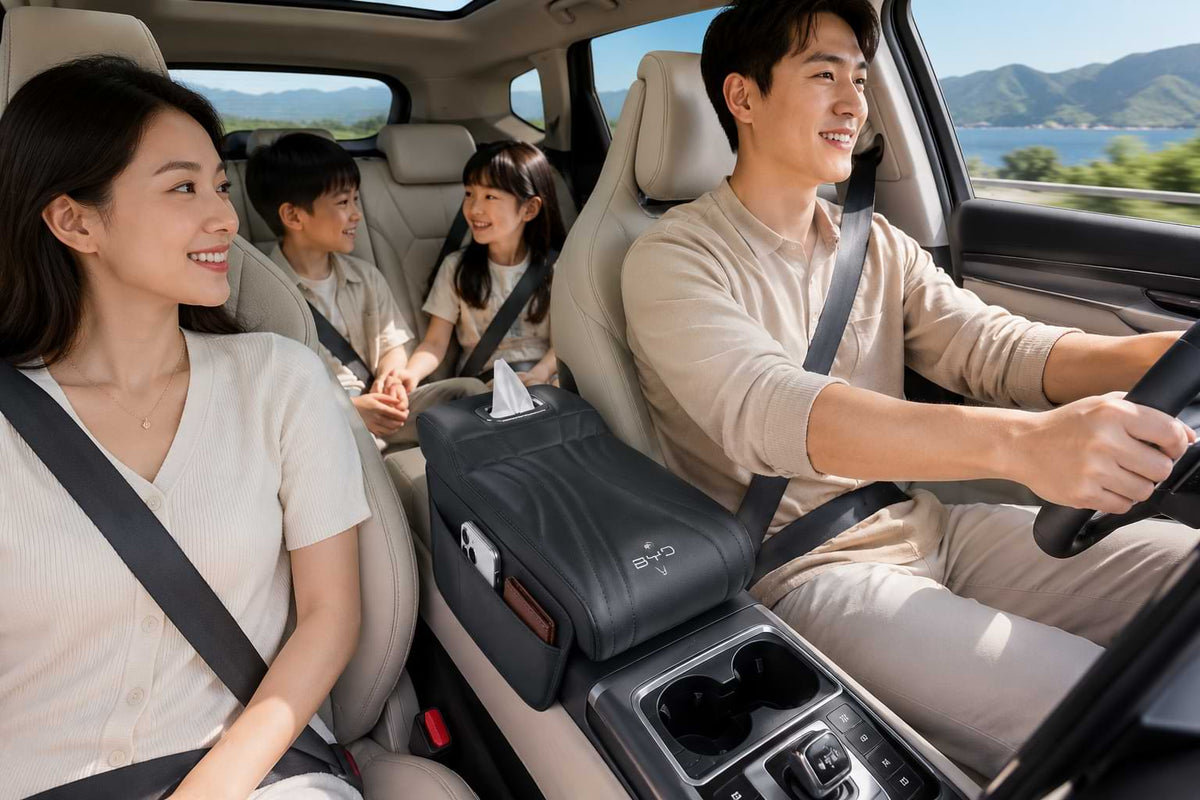 Family enjoying a road trip in a BYD vehicle with a premium armrest box heightening pad featuring storage pocket and tissue holder.