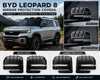 BYD Leopard 8 2024-2025 rearview mirror protection cover comparison showing Bright Black and Carbon Fiber Black ABS mirror covers installed on the vehicle.
