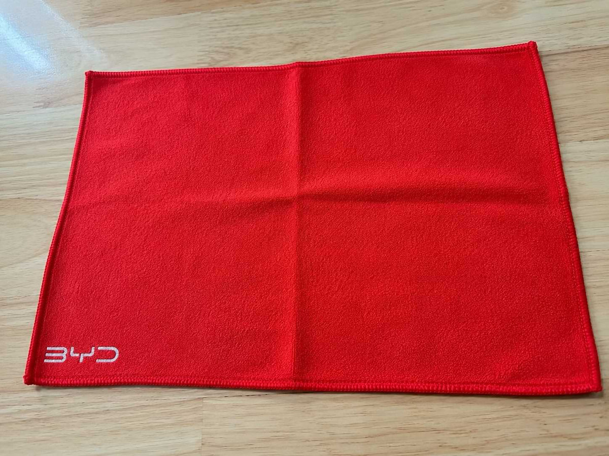 Red BYD microfiber car wash and drying towel made from coral velvet fabric, 295x195mm reusable cleaning cloth for vehicle detailing and interior care.