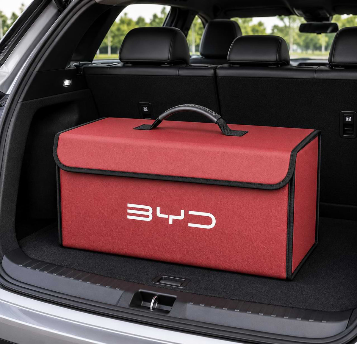 Red BYD foldable trunk storage organizer box placed inside a vehicle cargo area for organized storage and travel essentials