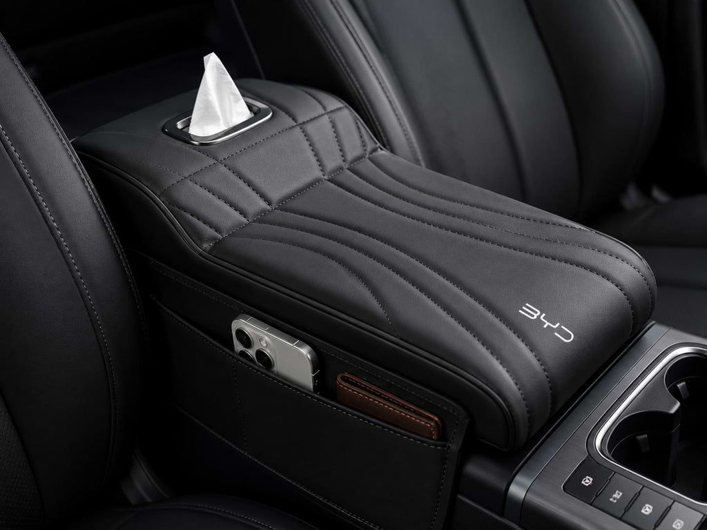 BYD Sealion 6 interior featuring a premium armrest box height extender with side storage pocket, tissue holder, and BYD logo.