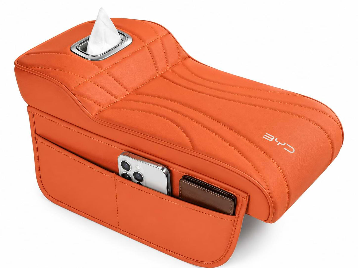 Orange leather BYD armrest box height extender with side storage pocket and tissue holder installed in a BYD Sealion 6 interior.