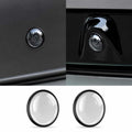 Front and rear camera lens protector covers installed on BYD vehicle cameras with two clear protective lens covers displayed below.
