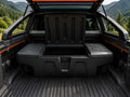 byd shark Open cargo area of a vehicle with a black storage box in a mountainous