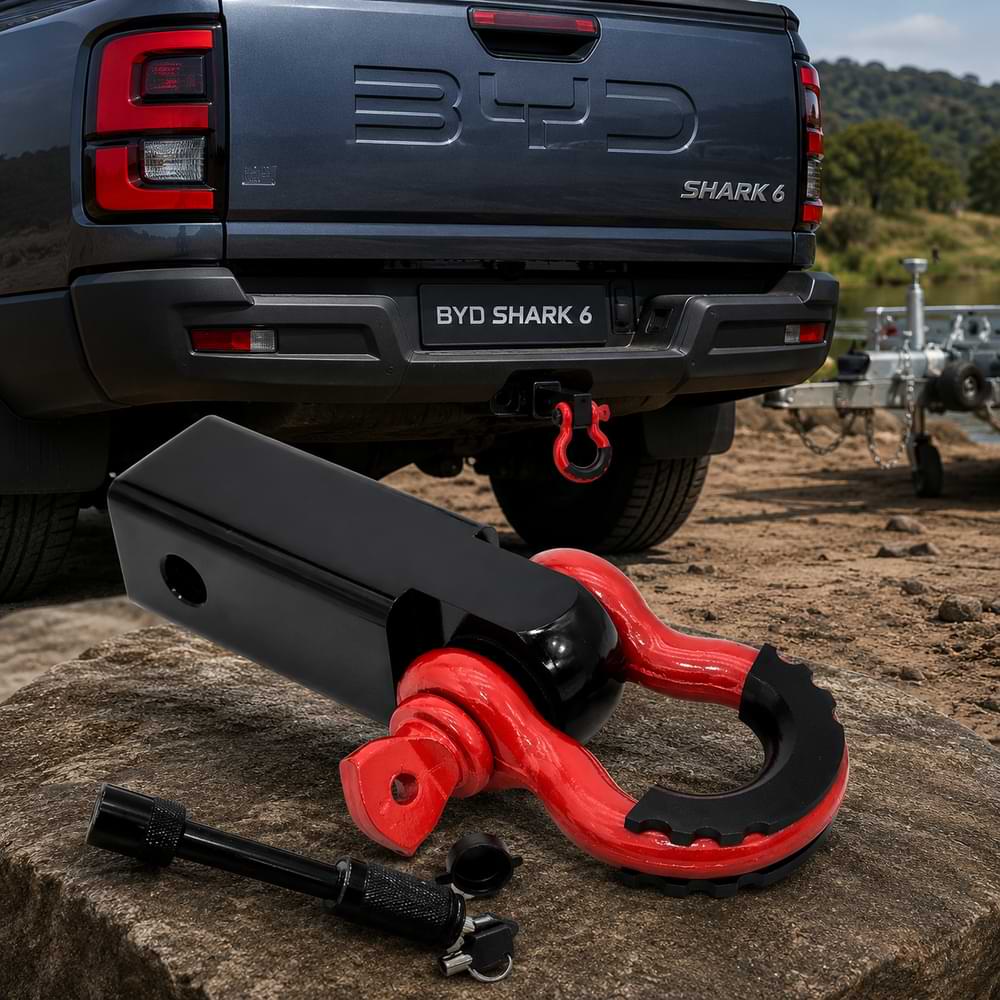 Red and black trailer tow hook connector installed on BYD Shark 6 rear towing hitch outdoors