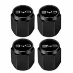 Four black tire valve stem caps with 'BYD' logo on a white background