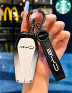 Premium zinc alloy and leather car key case cover with keychain for BYD Song Plus, Atto 3, Han EV, Qin, Seal and Dolphin smart key fob protection.