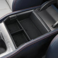 byd Car console organizer with compartments in a vehicle interior.