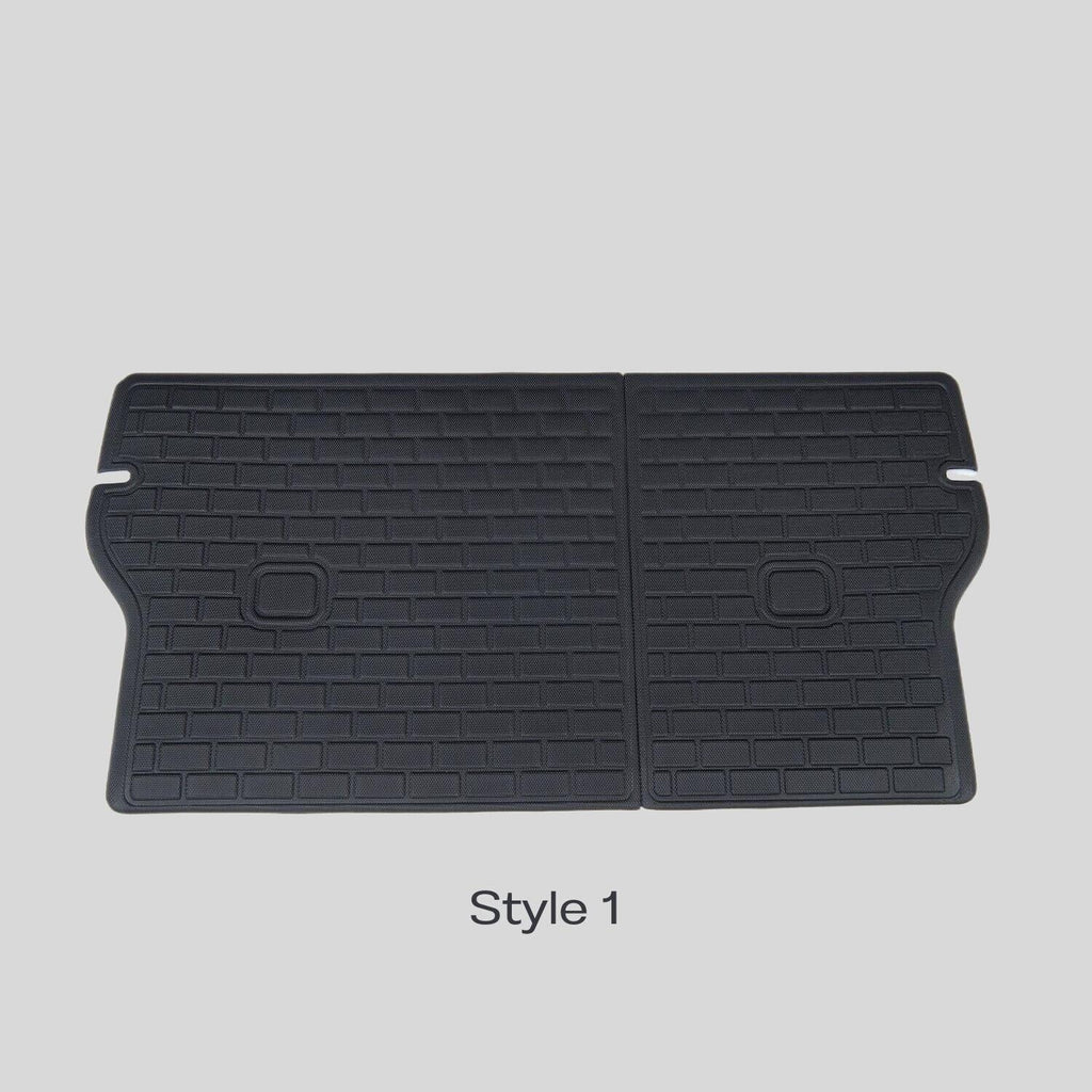Black TPE waterproof car trunk mat with anti-slip brick pattern texture.