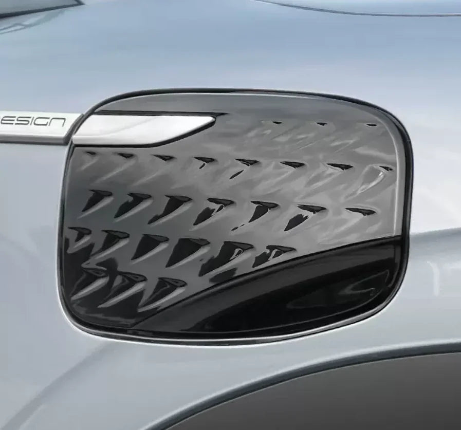 Glossy black textured fuel filler door cover for BYD, featuring a premium 3D pattern design.